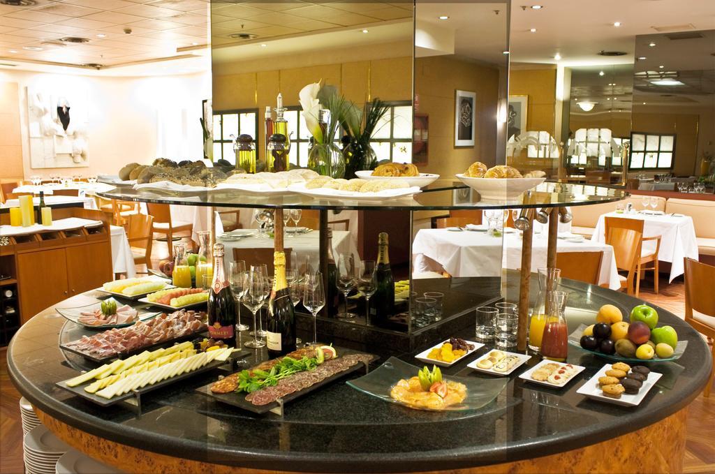 Hotel Miguel Angel Madrid Exterior photo A buffet at a hotel